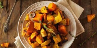 crispy roasted autumn root vegetables in a warm bowl